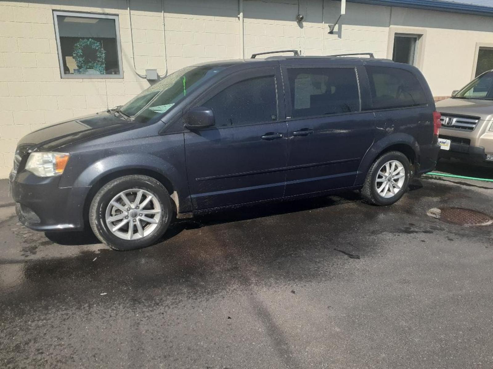 2014 Dodge Grand Caravan SXT (2C4RDGCG5ER) with an 3.6L V6 DOHC 24V engine, 6-Speed Automatic transmission, located at 2015 Cambell Street, Rapid City, SD, 57701, (605) 342-8326, 44.066433, -103.191772 - CARFAX AVAILABLE - Photo #2
