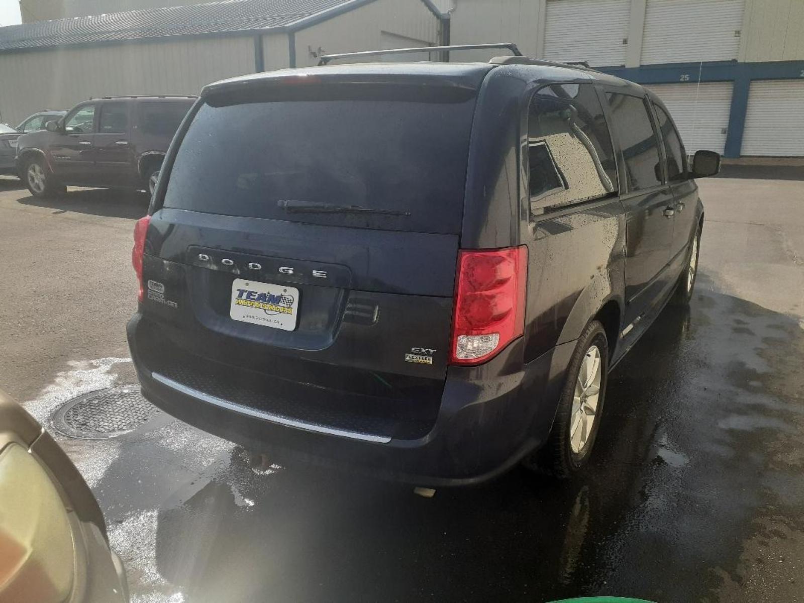 2014 Dodge Grand Caravan SXT (2C4RDGCG5ER) with an 3.6L V6 DOHC 24V engine, 6-Speed Automatic transmission, located at 2015 Cambell Street, Rapid City, SD, 57701, (605) 342-8326, 44.066433, -103.191772 - Photo #4