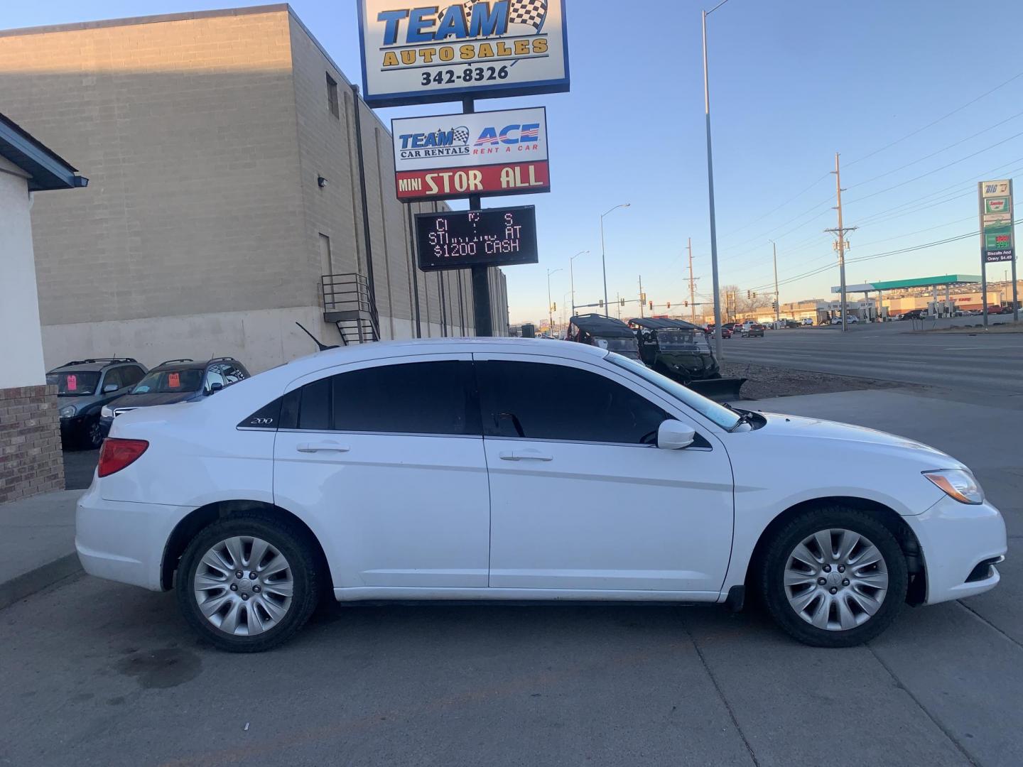 2014 White Chrysler 200 LX (1C3CCBAB6EN) with an 2.4L L4 DOHC 16V engine, 6-Speed Automatic transmission, located at 2015 Cambell Street, Rapid City, SD, 57701, (605) 342-8326, 44.066433, -103.191772 - CARFAX AVAILABLE - Photo#0