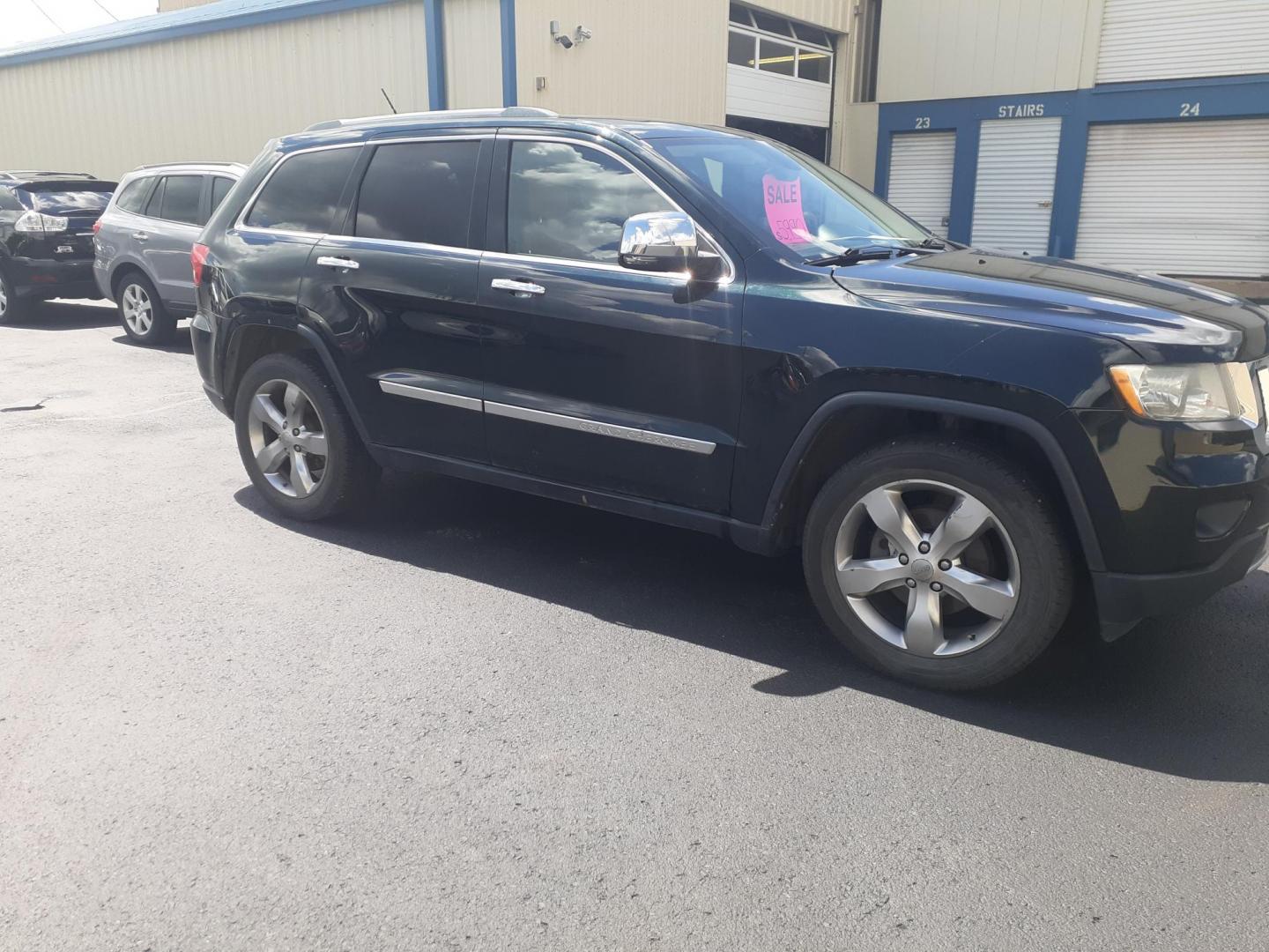2012 Jeep Grand Cherokee Overland 4WD (1C4RJFCG6CC) with an 3.6L V6 DOHC 24V engine, 5-Speed Automatic transmission, located at 2015 Cambell Street, Rapid City, SD, 57701, (605) 342-8326, 44.066433, -103.191772 - CARFAX AVAILABLE NO FINANCING AVAILABLE CASH SALE ONLY VEHICLE - Photo#5