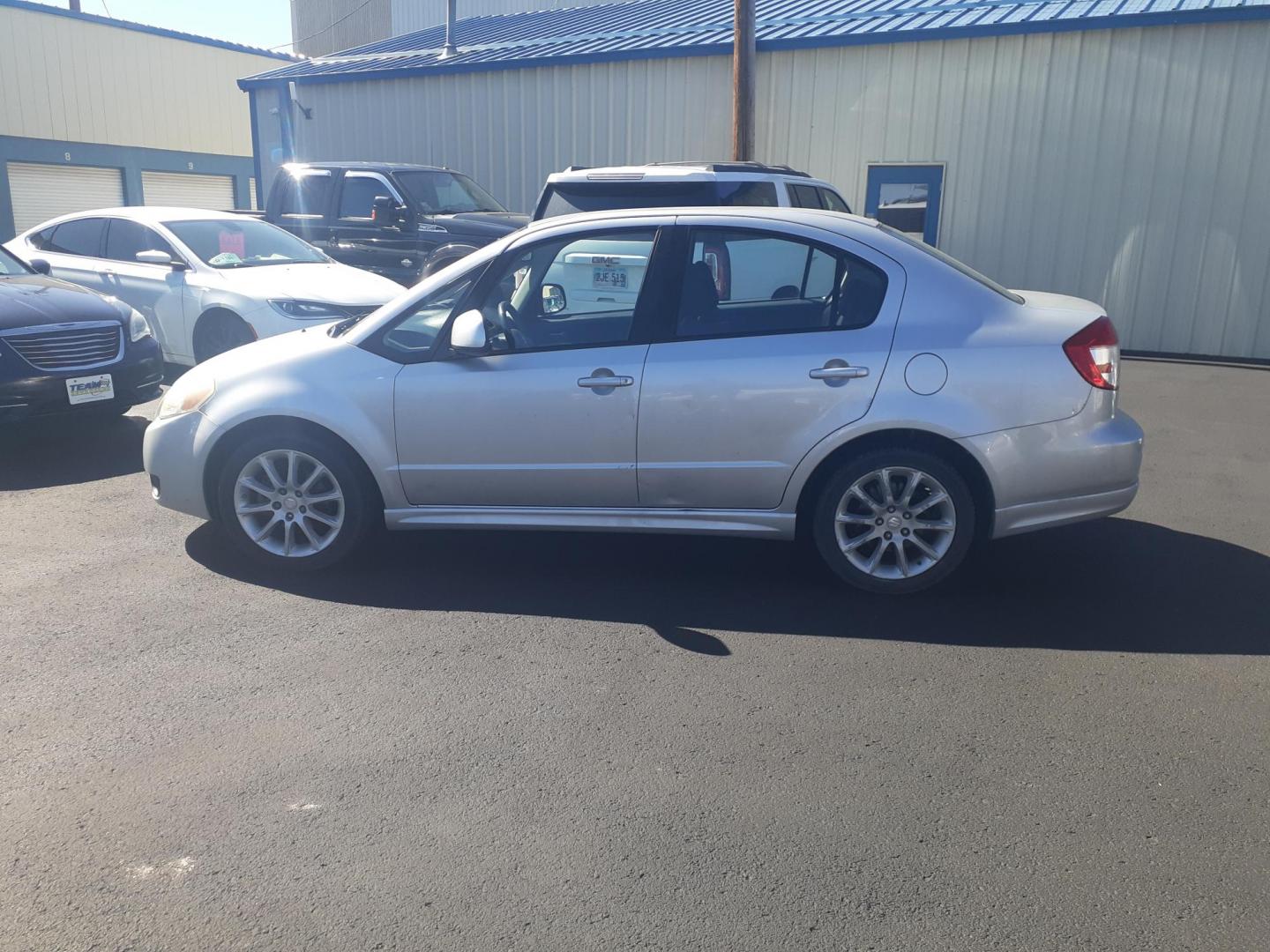 2009 Suzuki SX4 Sport Base (JS2YC414696) with an 2.0L L4 DOHC 16V engine, located at 2015 Cambell Street, Rapid City, SD, 57701, (605) 342-8326, 44.066433, -103.191772 - CARFAX AVAILABLE - Photo#0
