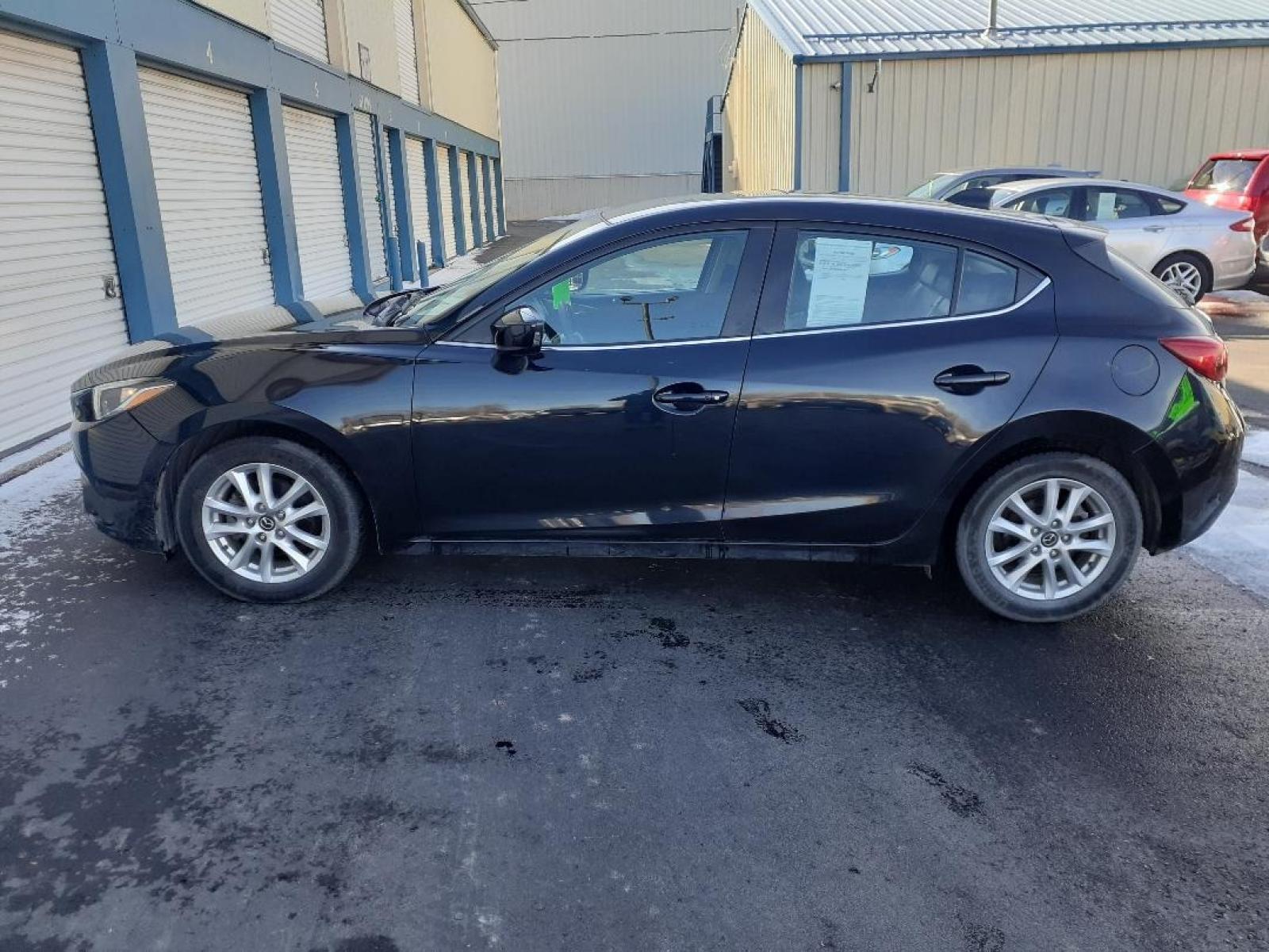 2015 Mazda MAZDA3 i Grand Touring AT 5-Door (JM1BM1M71F1) with an 2.0L L4 DOHC 16V engine, 6-Speed Automatic transmission, located at 2015 Cambell Street, Rapid City, SD, 57701, (605) 342-8326, 44.066433, -103.191772 - CARFAX AVAILABLE - Photo #0