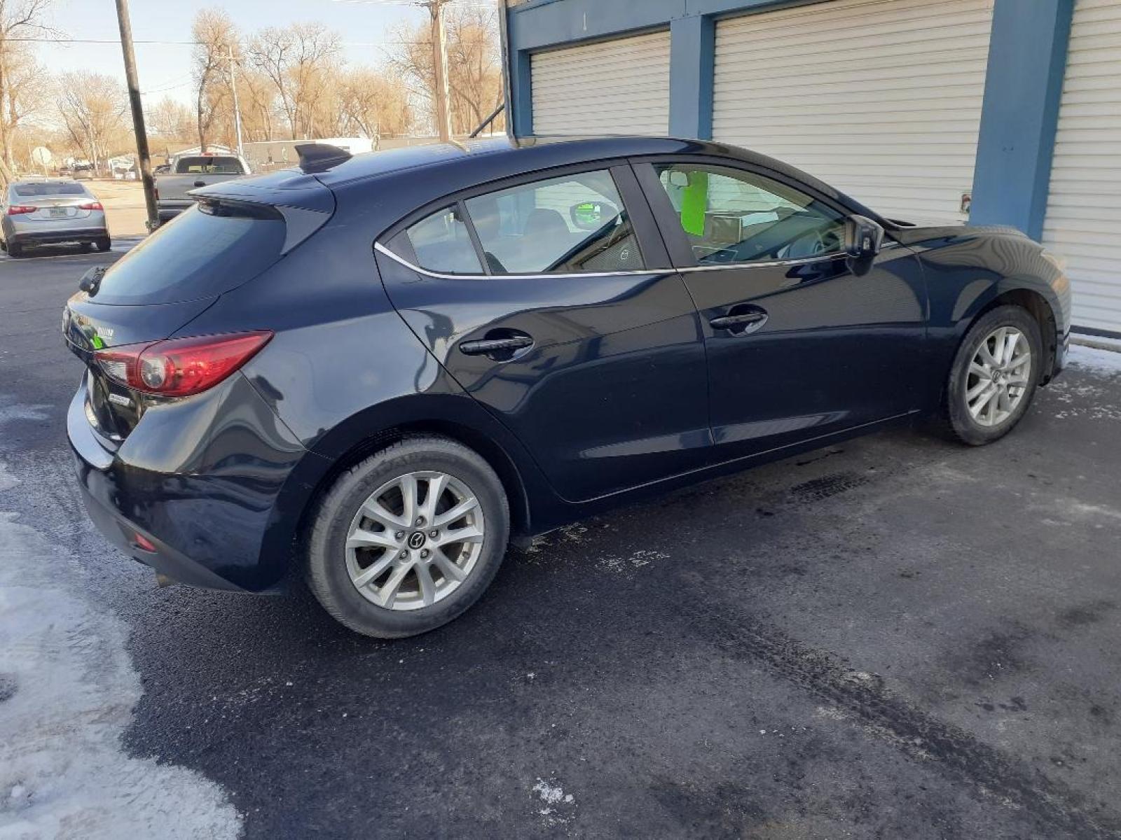 2015 Mazda MAZDA3 i Grand Touring AT 5-Door (JM1BM1M71F1) with an 2.0L L4 DOHC 16V engine, 6-Speed Automatic transmission, located at 2015 Cambell Street, Rapid City, SD, 57701, (605) 342-8326, 44.066433, -103.191772 - CARFAX AVAILABLE - Photo #4