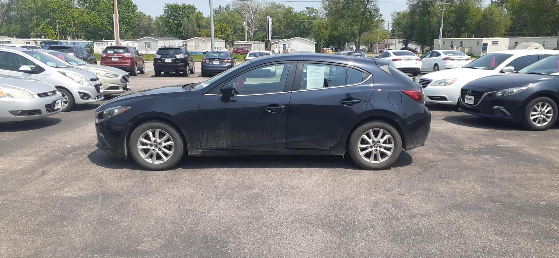 2015 Mazda MAZDA3 i Grand Touring AT 5-Door (JM1BM1M71F1) with an 2.0L L4 DOHC 16V engine, 6-Speed Automatic transmission, located at 2015 Cambell Street, Rapid City, SD, 57701, (605) 342-8326, 44.066433, -103.191772 - CARFAX AVAILABLE - Photo#0