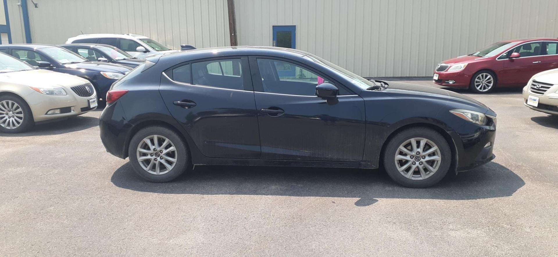 2015 Mazda MAZDA3 i Grand Touring AT 5-Door (JM1BM1M71F1) with an 2.0L L4 DOHC 16V engine, 6-Speed Automatic transmission, located at 2015 Cambell Street, Rapid City, SD, 57701, (605) 342-8326, 44.066433, -103.191772 - CARFAX AVAILABLE - Photo#1