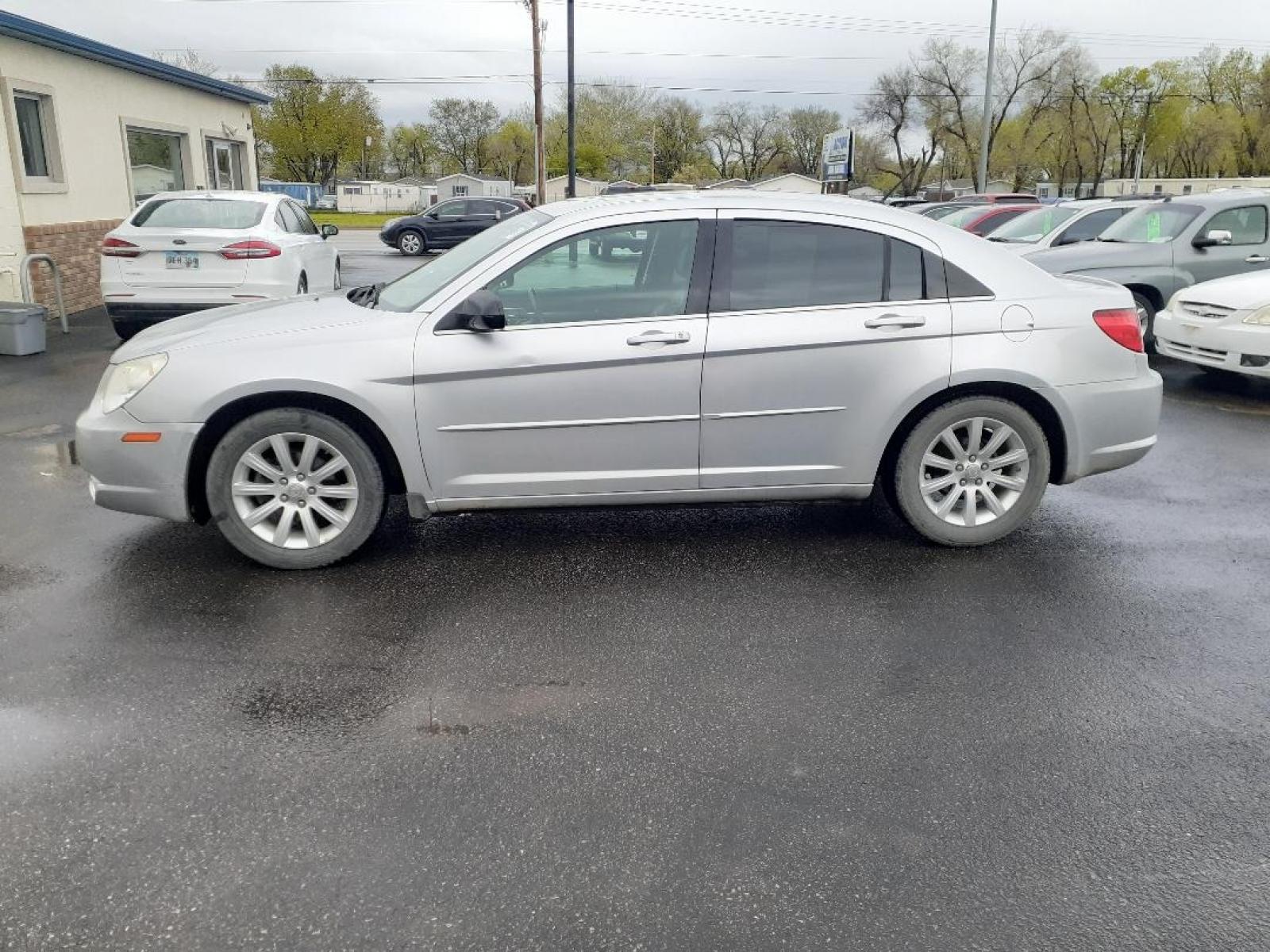 2010 Chrysler Sebring Sedan Limited (1C3CC5FD2AN) with an 2.7L V6 DOHC 24V FFV engine, 4-Speed Automatic transmission, located at 2015 Cambell Street, Rapid City, SD, 57701, (605) 342-8326, 44.066433, -103.191772 - CARFAX AVAILABLE - Photo #0
