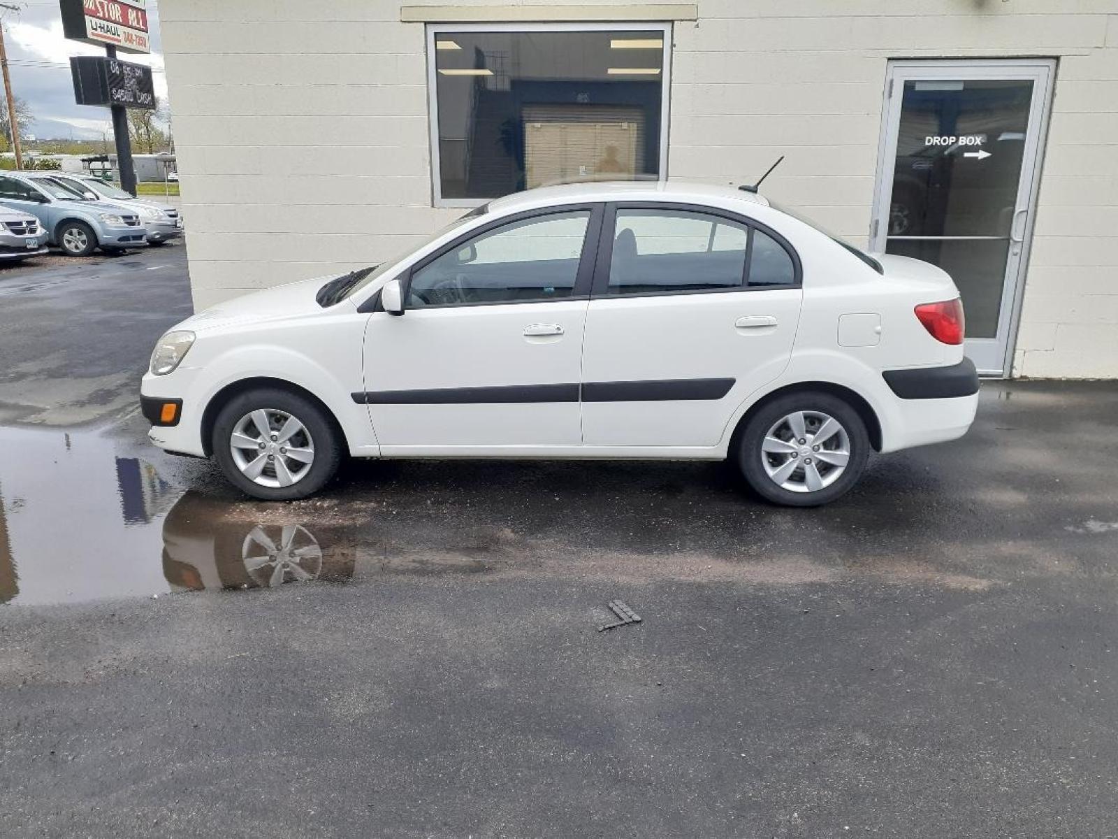 2009 Kia Rio Base (KNADE223496) with an 1.6 DOHC 24V engine, Automatic transmission, located at 2015 Cambell Street, Rapid City, SD, 57701, (605) 342-8326, 44.066433, -103.191772 - CARFAX AVAILABLE - Photo #0