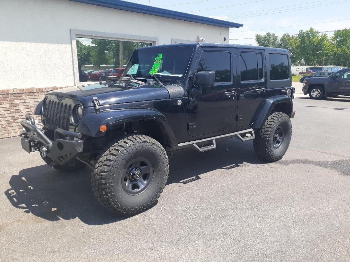 2015 Jeep Wrangler Unlimited Sahara 4WD (1C4BJWEGXFL) with an 3.6L V6 DOHC 24V FFV engine, located at 2015 Cambell Street, Rapid City, SD, 57701, (605) 342-8326, 44.066433, -103.191772 - CARFAX AVAILABLE - Photo#1