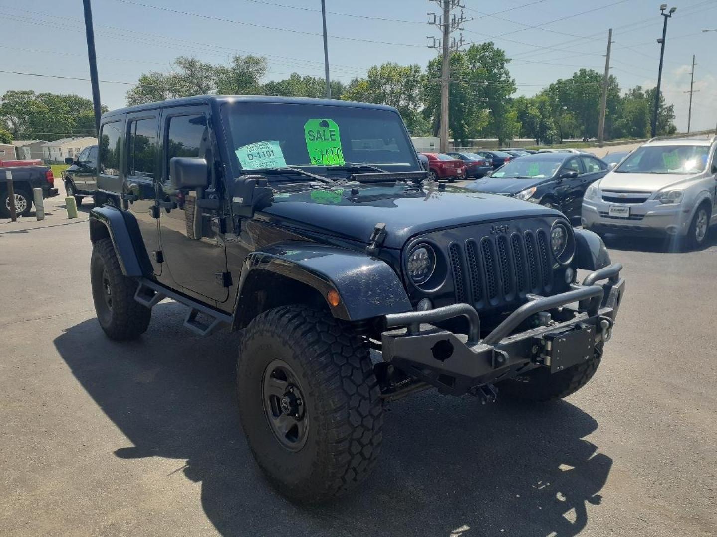 2015 Jeep Wrangler Unlimited Sahara 4WD (1C4BJWEGXFL) with an 3.6L V6 DOHC 24V FFV engine, located at 2015 Cambell Street, Rapid City, SD, 57701, (605) 342-8326, 44.066433, -103.191772 - CARFAX AVAILABLE - Photo#3