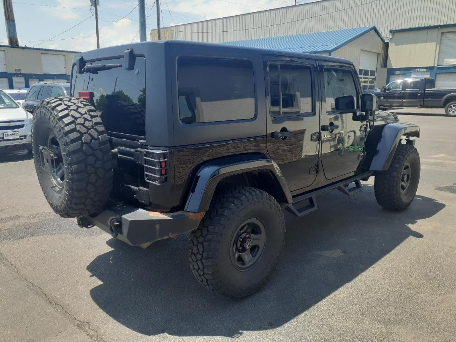 2015 Jeep Wrangler Unlimited Sahara 4WD (1C4BJWEGXFL) with an 3.6L V6 DOHC 24V FFV engine, located at 2015 Cambell Street, Rapid City, SD, 57701, (605) 342-8326, 44.066433, -103.191772 - CARFAX AVAILABLE - Photo #5