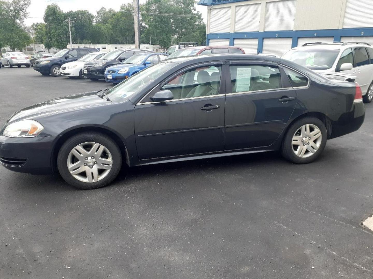 2013 Chevrolet Impala LT (2G1WB5E38D1) with an 3.6L V6 DOHC 16V FFV engine, 6-Speed Automatic transmission, located at 2015 Cambell Street, Rapid City, SD, 57701, (605) 342-8326, 44.066433, -103.191772 - CARFAX AVAILABLE - Photo#0