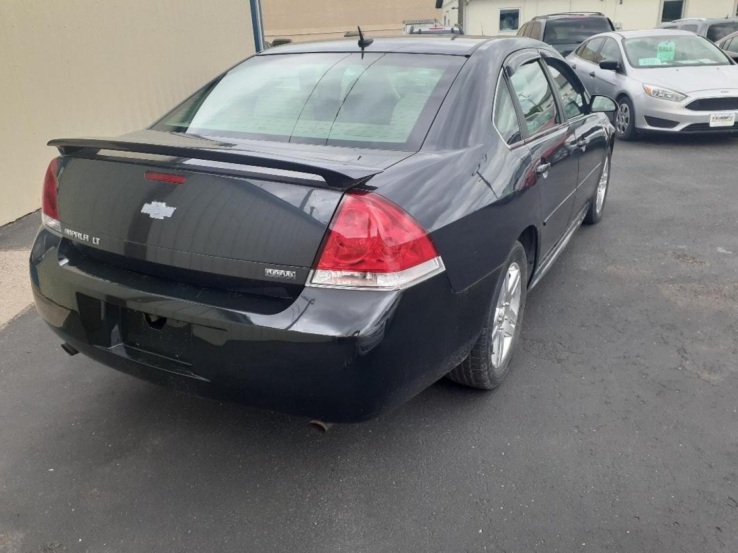 2013 Chevrolet Impala LT (2G1WB5E38D1) with an 3.6L V6 DOHC 16V FFV engine, 6-Speed Automatic transmission, located at 2015 Cambell Street, Rapid City, SD, 57701, (605) 342-8326, 44.066433, -103.191772 - CARFAX AVAILABLE - Photo#4