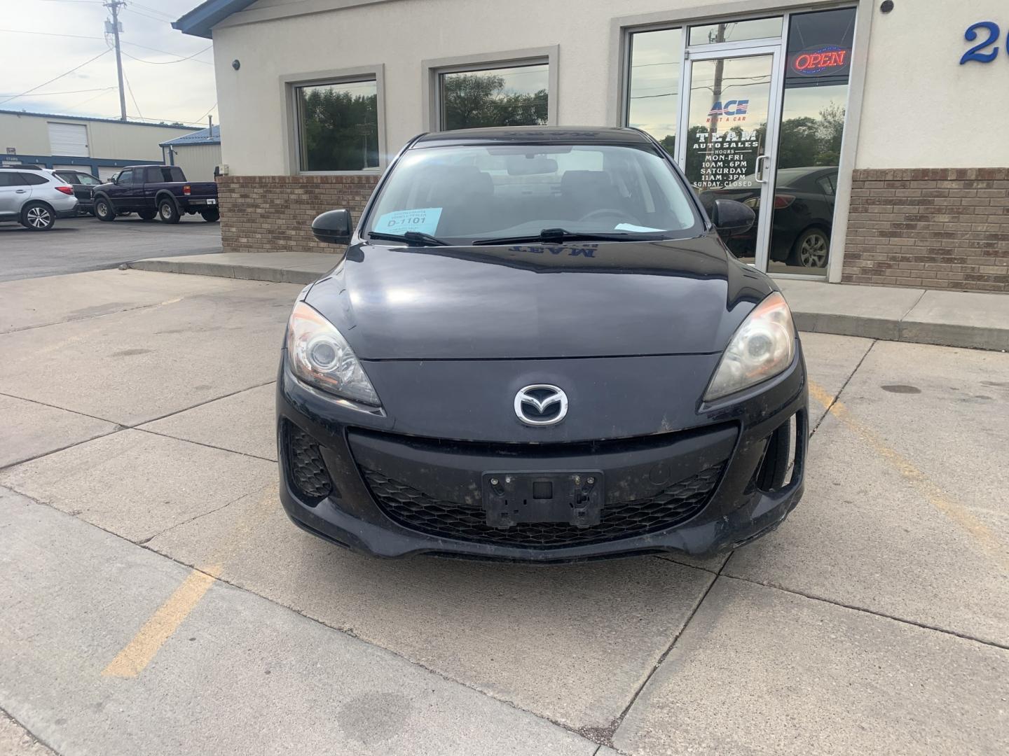2012 black Mazda MAZDA3 i Sport 4-Door (JM1BL1UGXC1) with an 2.0L L4 DOHC 16V engine, located at 2015 Cambell Street, Rapid City, SD, 57701, (605) 342-8326, 44.066433, -103.191772 - CARFAX AVAILABLE fresh trade CASH ONLY BIG DENT ON PASSENGER REAR DOOR!!!- Photo#2