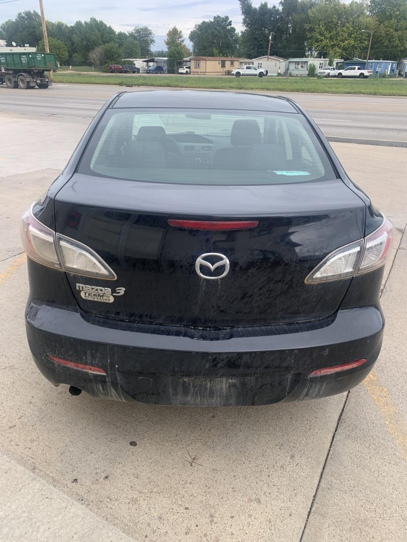 2012 black Mazda MAZDA3 i Sport 4-Door (JM1BL1UGXC1) with an 2.0L L4 DOHC 16V engine, located at 2015 Cambell Street, Rapid City, SD, 57701, (605) 342-8326, 44.066433, -103.191772 - CARFAX AVAILABLE fresh trade CASH ONLY BIG DENT ON PASSENGER REAR DOOR!!!- Photo#4