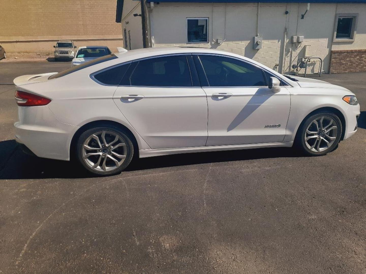 2019 Ford Fusion Hybrid Titanium (3FA6P0RU3KR) with an 2.0L L4 DOHC 16V HYBRID engine, CVT transmission, located at 2015 Cambell Street, Rapid City, SD, 57701, (605) 342-8326, 44.066433, -103.191772 - CARFAX AVAILABLE - Photo#1