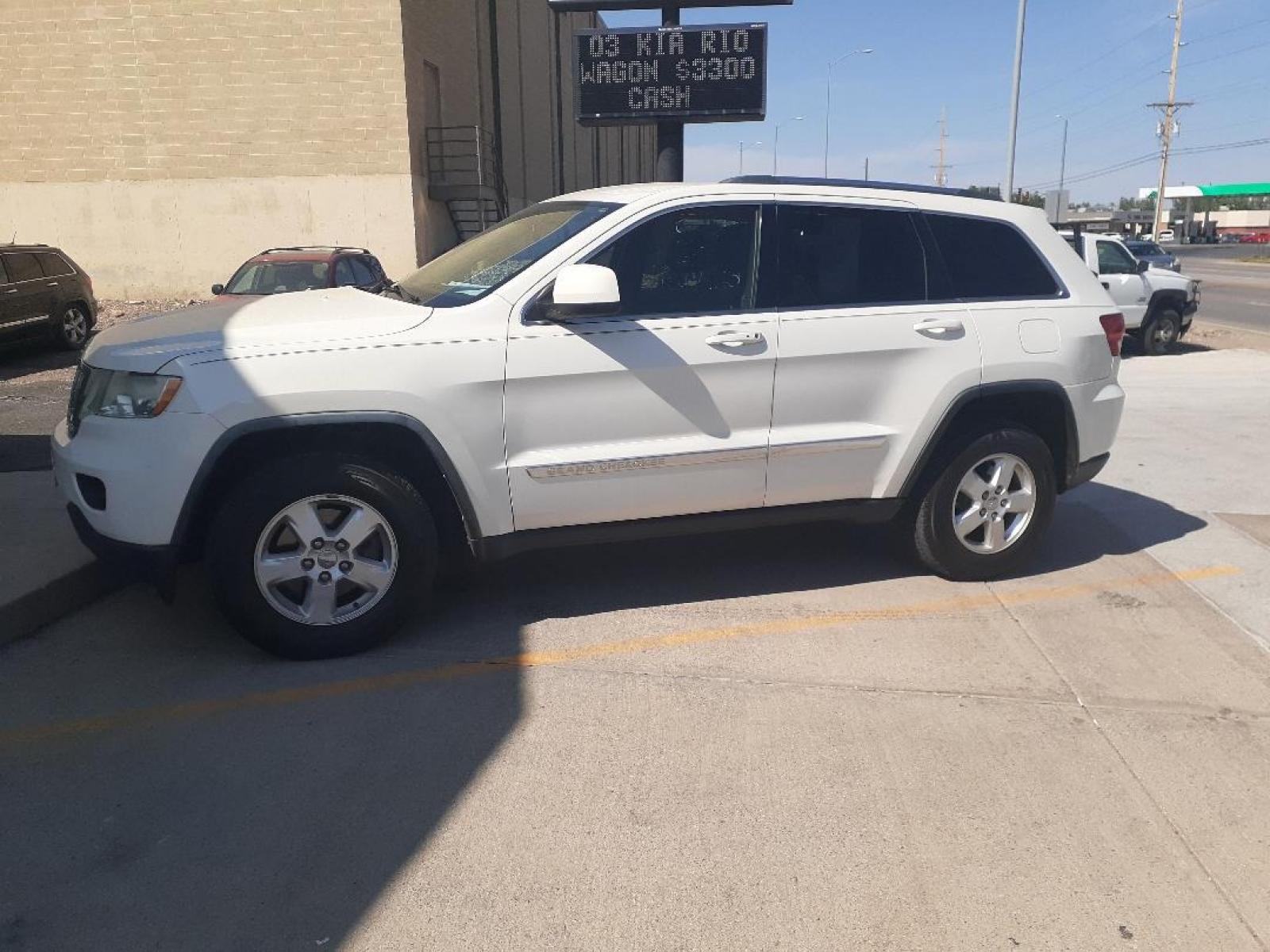 2012 Jeep Grand Cherokee Laredo 4WD (1C4RJFAG0CC) with an 3.6L V6 DOHC 24V engine, 5-Speed Automatic transmission, located at 2015 Cambell Street, Rapid City, SD, 57701, (605) 342-8326, 44.066433, -103.191772 - CARFAX AVAILABLE - Photo #0