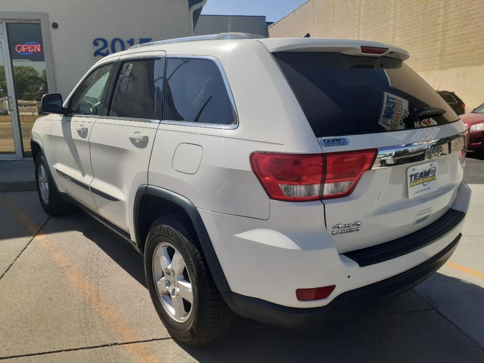 2012 Jeep Grand Cherokee Laredo 4WD (1C4RJFAG0CC) with an 3.6L V6 DOHC 24V engine, 5-Speed Automatic transmission, located at 2015 Cambell Street, Rapid City, SD, 57701, (605) 342-8326, 44.066433, -103.191772 - CARFAX AVAILABLE - Photo #2
