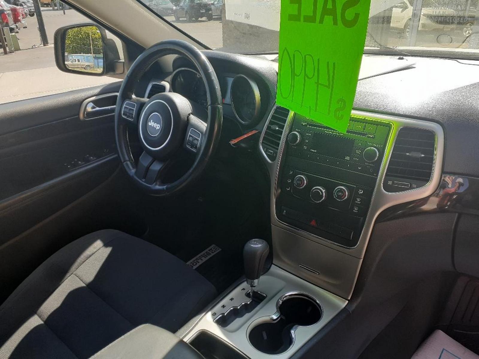 2012 Jeep Grand Cherokee Laredo 4WD (1C4RJFAG0CC) with an 3.6L V6 DOHC 24V engine, 5-Speed Automatic transmission, located at 2015 Cambell Street, Rapid City, SD, 57701, (605) 342-8326, 44.066433, -103.191772 - CARFAX AVAILABLE - Photo #7