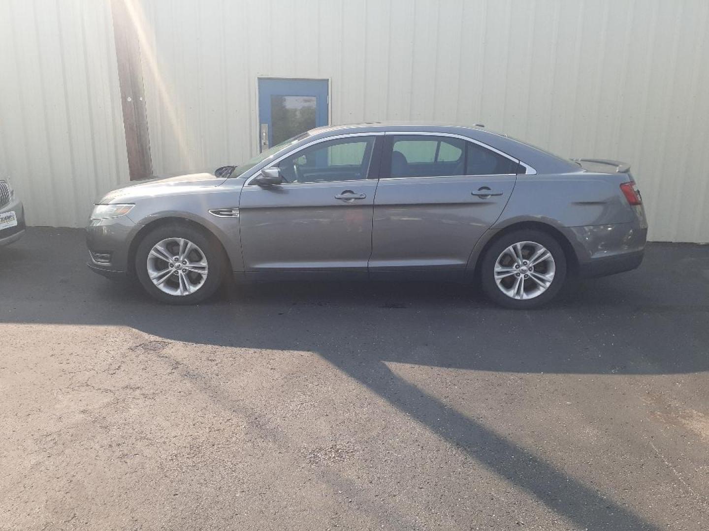 2014 Ford Taurus SEL FWD (1FAHP2E89EG) with an 3.5L V6 DOHC 24V engine, 6-Speed Automatic transmission, located at 2015 Cambell Street, Rapid City, SD, 57701, (605) 342-8326, 44.066433, -103.191772 - Photo#0