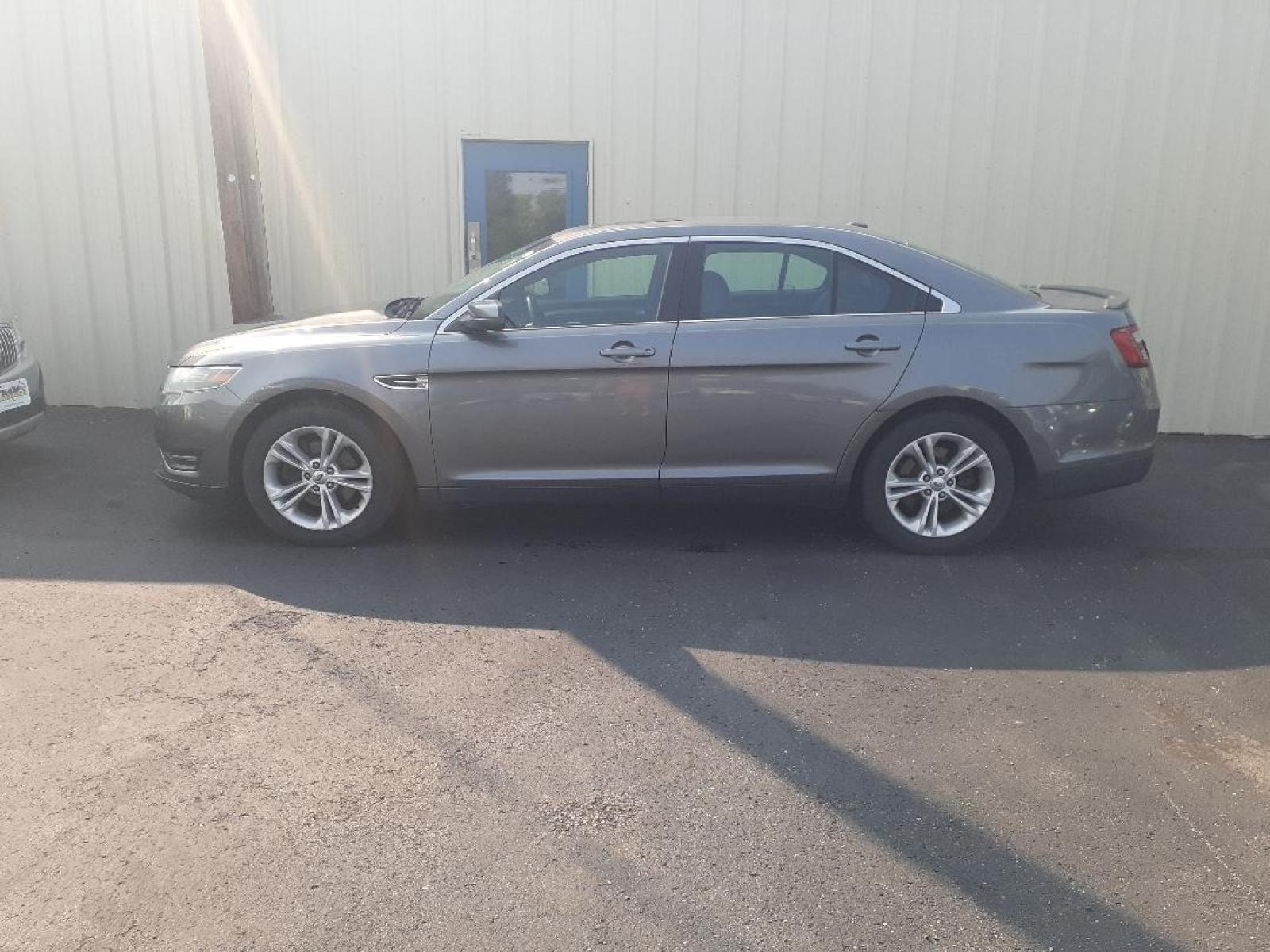 2014 Ford Taurus SEL FWD (1FAHP2E89EG) with an 3.5L V6 DOHC 24V engine, 6-Speed Automatic transmission, located at 2015 Cambell Street, Rapid City, SD, 57701, (605) 342-8326, 44.066433, -103.191772 - CARFAX AVAILABLE - Photo #0