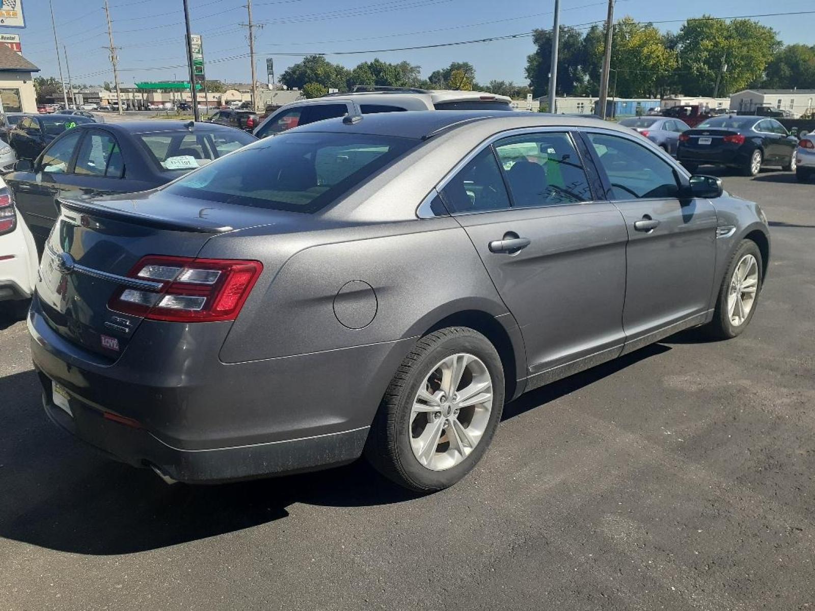 2014 Ford Taurus SEL FWD (1FAHP2E89EG) with an 3.5L V6 DOHC 24V engine, 6-Speed Automatic transmission, located at 2015 Cambell Street, Rapid City, SD, 57701, (605) 342-8326, 44.066433, -103.191772 - CARFAX AVAILABLE - Photo #1