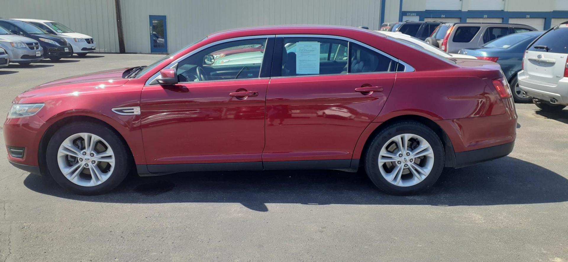 2015 Ford Taurus SEL FWD (1FAHP2E80FG) with an 3.5L V6 DOHC 24V engine, 6-Speed Automatic transmission, located at 2015 Cambell Street, Rapid City, SD, 57701, (605) 342-8326, 44.066433, -103.191772 - CARFAX AVAILABLE - Photo#0