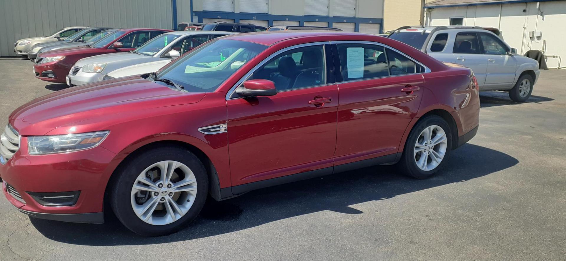 2015 Ford Taurus SEL FWD (1FAHP2E80FG) with an 3.5L V6 DOHC 24V engine, 6-Speed Automatic transmission, located at 2015 Cambell Street, Rapid City, SD, 57701, (605) 342-8326, 44.066433, -103.191772 - CARFAX AVAILABLE - Photo#1