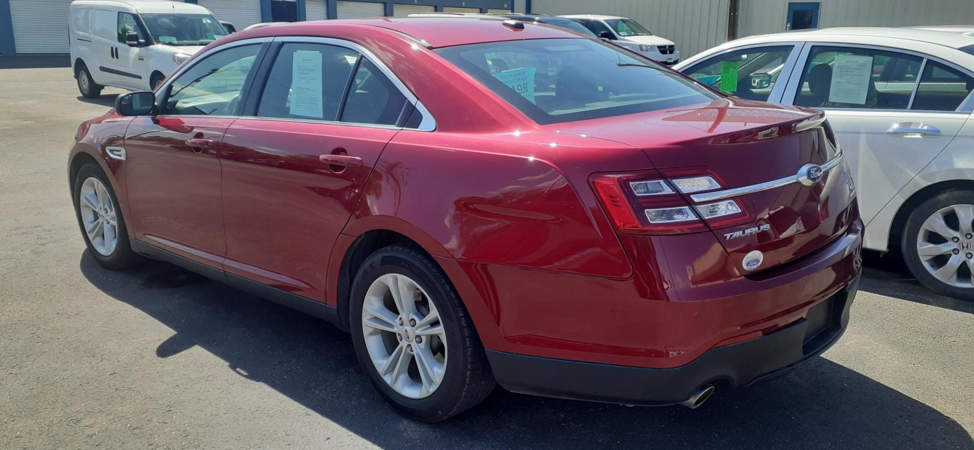 2015 Ford Taurus SEL FWD (1FAHP2E80FG) with an 3.5L V6 DOHC 24V engine, 6-Speed Automatic transmission, located at 2015 Cambell Street, Rapid City, SD, 57701, (605) 342-8326, 44.066433, -103.191772 - CARFAX AVAILABLE - Photo#3