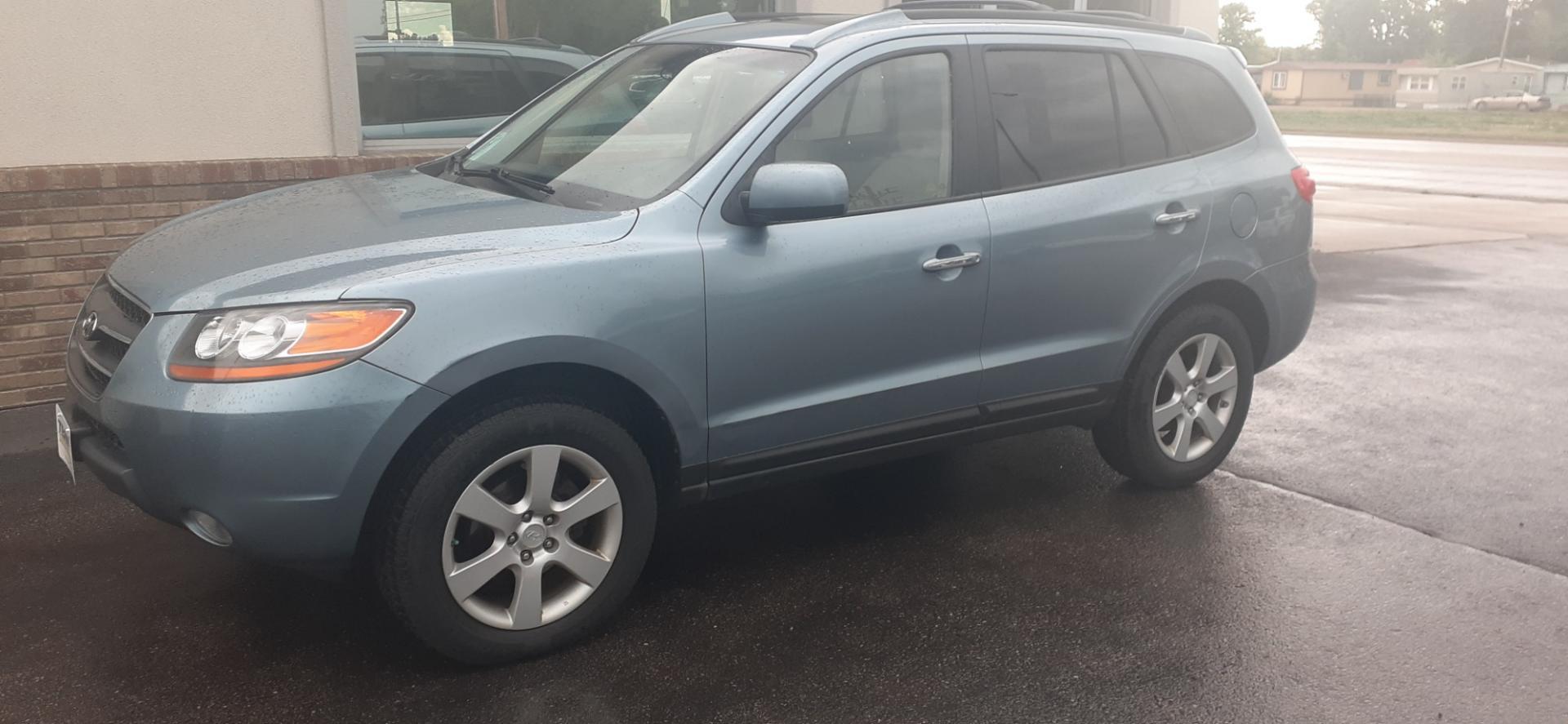 2009 Hyundai Santa Fe Limited AWD (5NMSH73E39H) with an 3.3L V6 DOHC 24V engine, 5-Speed Automatic transmission, located at 2015 Cambell Street, Rapid City, SD, 57701, (605) 342-8326, 44.066433, -103.191772 - Photo#1