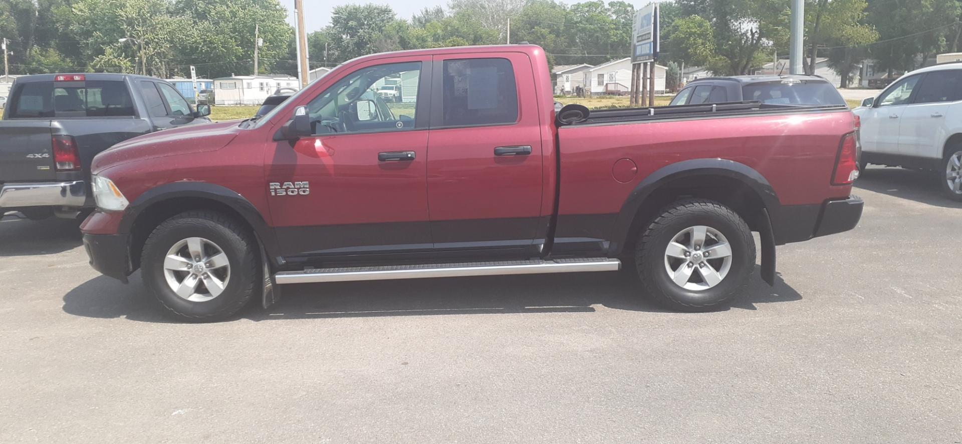 2015 RAM 1500 SLT Quad Cab 4WD (1C6RR7GGXFS) with an 3.6L V6 DOHC 24V FFV engine, 6-Speed Automatic transmission, located at 2015 Cambell Street, Rapid City, SD, 57701, (605) 342-8326, 44.066433, -103.191772 - Photo#0