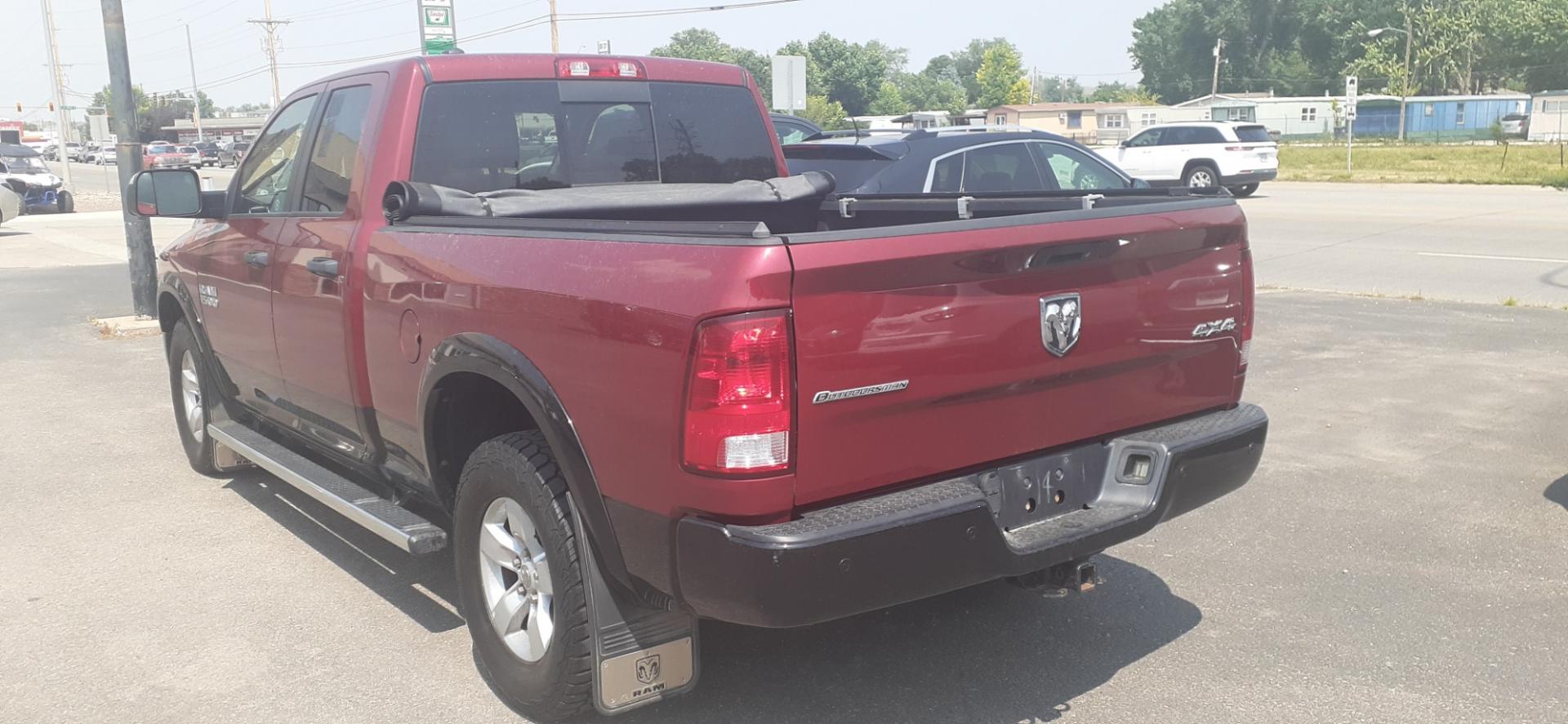 2015 RAM 1500 SLT Quad Cab 4WD (1C6RR7GGXFS) with an 3.6L V6 DOHC 24V FFV engine, 6-Speed Automatic transmission, located at 2015 Cambell Street, Rapid City, SD, 57701, (605) 342-8326, 44.066433, -103.191772 - Photo#2