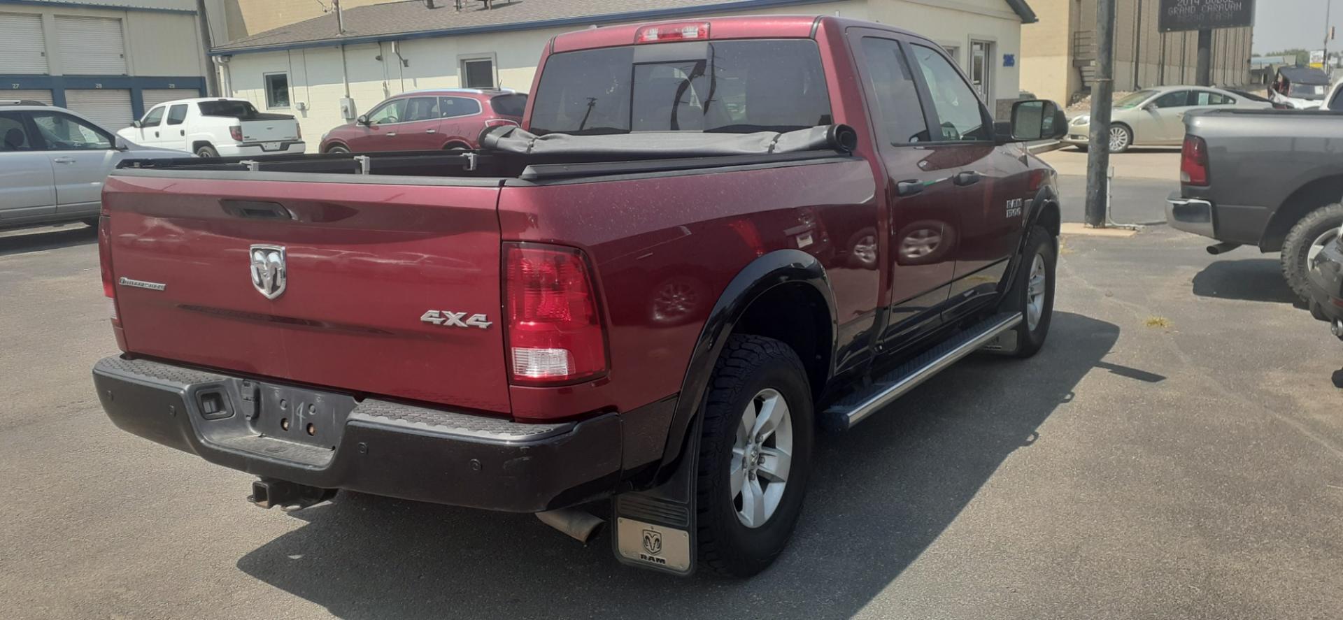 2015 RAM 1500 SLT Quad Cab 4WD (1C6RR7GGXFS) with an 3.6L V6 DOHC 24V FFV engine, 6-Speed Automatic transmission, located at 2015 Cambell Street, Rapid City, SD, 57701, (605) 342-8326, 44.066433, -103.191772 - Photo#3