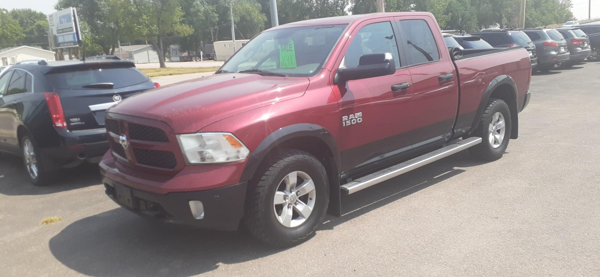 2015 RAM 1500 SLT Quad Cab 4WD (1C6RR7GGXFS) with an 3.6L V6 DOHC 24V FFV engine, 6-Speed Automatic transmission, located at 2015 Cambell Street, Rapid City, SD, 57701, (605) 342-8326, 44.066433, -103.191772 - Photo#1