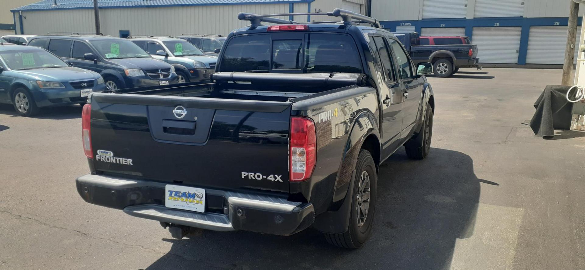 2014 Nissan Frontier SL Crew Cab 4WD (1N6AD0EV8EN) with an 4.0L V6 DOHC 24V engine, 5-Speed Automatic transmission, located at 2015 Cambell Street, Rapid City, SD, 57701, (605) 342-8326, 44.066433, -103.191772 - CARFAX AVAILABLE - Photo#2