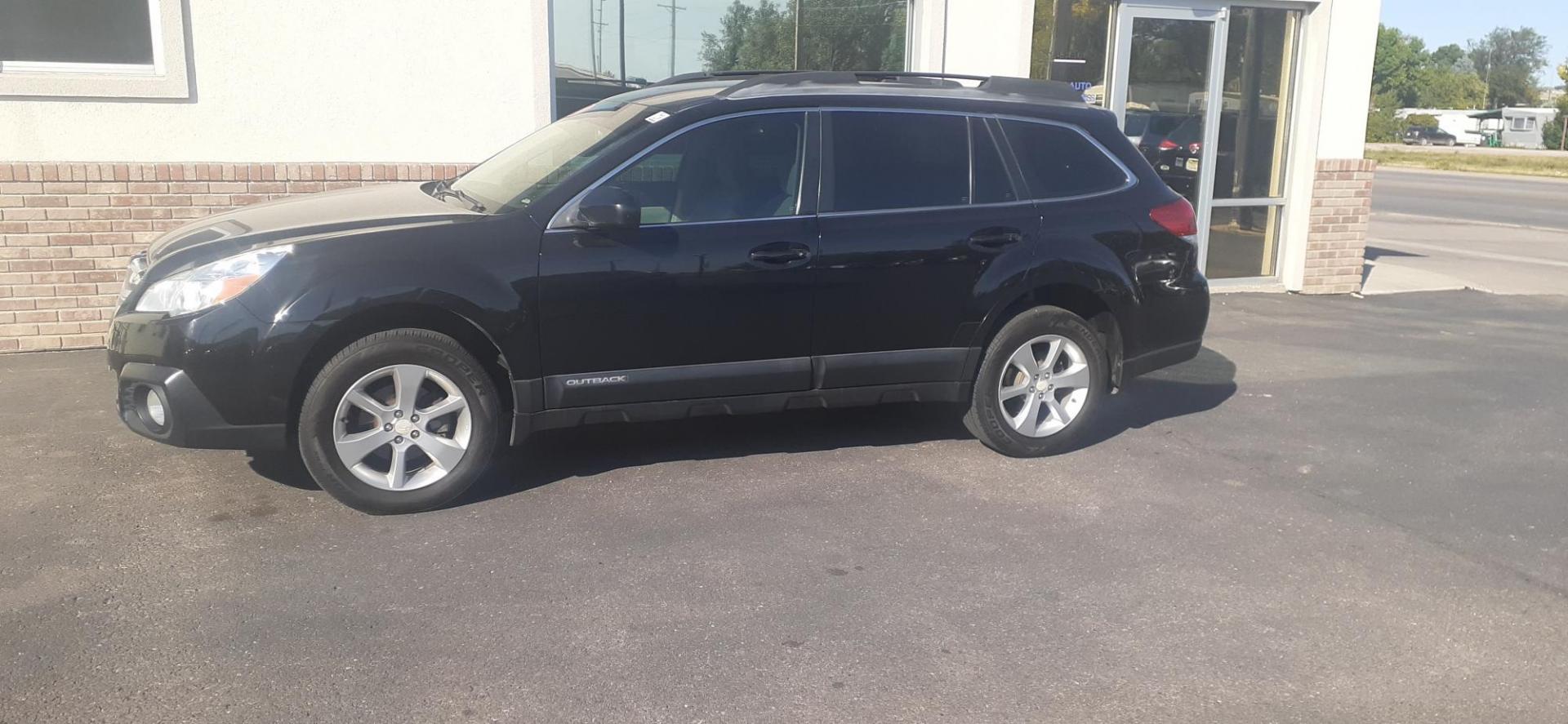 2014 Crystal Black Silica Subaru Outback 2.5i (4S4BRCAC1E3) with an 2.5L H4 DOHC 16V engine, located at 2015 Cambell Street, Rapid City, SD, 57701, (605) 342-8326, 44.066433, -103.191772 - CARFAX AVAILABLE - Photo#1