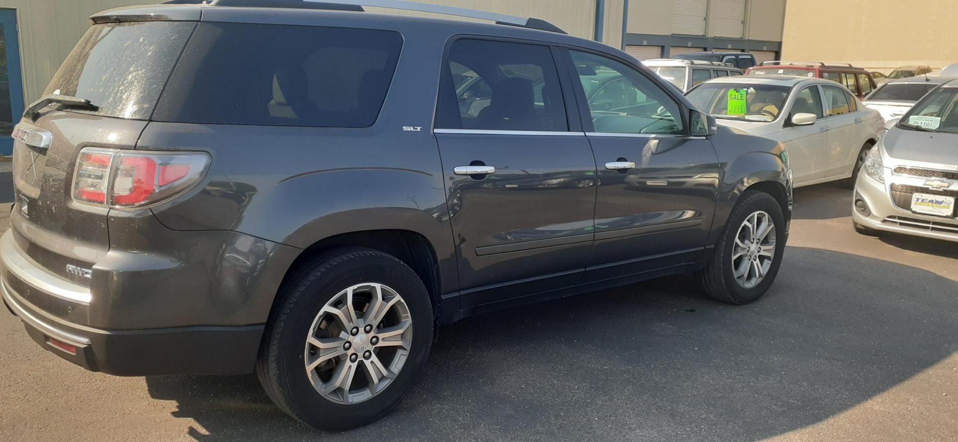 2014 GMC Acadia SLT-2 AWD (1GKKVSKD3EJ) with an 3.6L V6 DOHC 24V engine, 6-Speed Automatic transmission, located at 2015 Cambell Street, Rapid City, SD, 57701, (605) 342-8326, 44.066433, -103.191772 - Photo#3