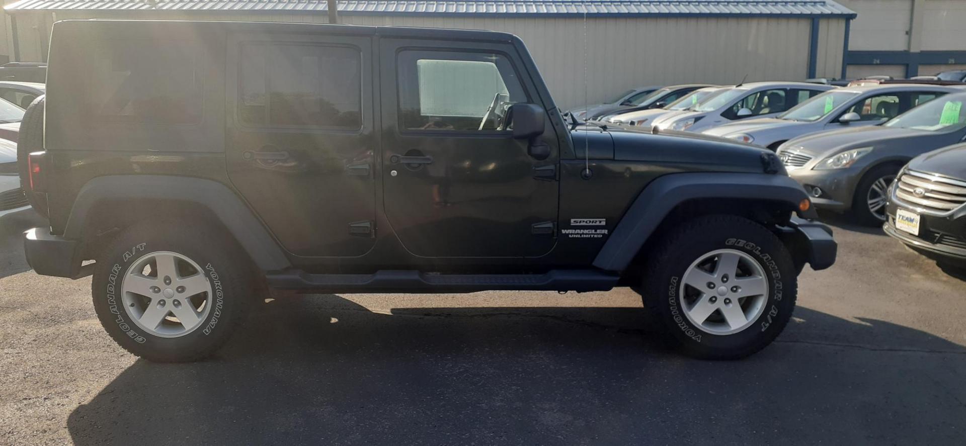 2011 Jeep Wrangler Unlimited Sport 4WD (1J4BA3H13BL) with an 3.8L V6 OHV 12V engine, located at 2015 Cambell Street, Rapid City, SD, 57701, (605) 342-8326, 44.066433, -103.191772 - CARFAX AVAILABLE - Photo#3