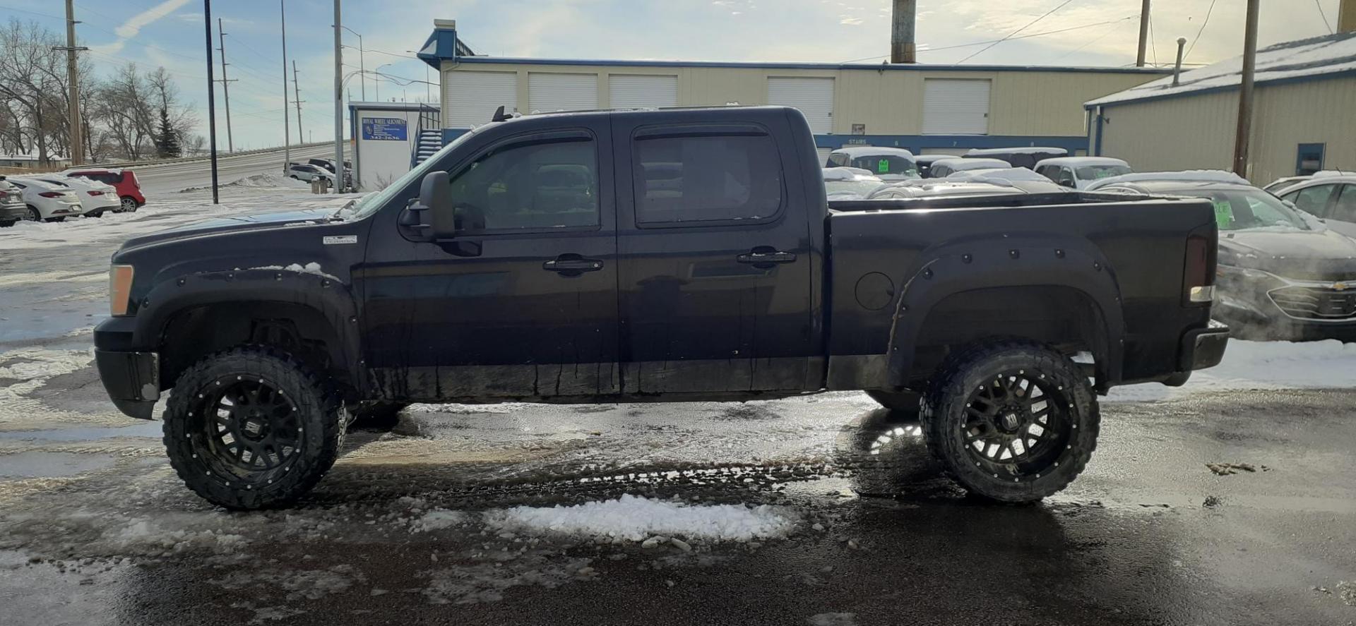 2009 GMC Sierra 1500 SLT Crew Cab 4WD (3GTEK33239G) with an 6.2L V8 OHV 16V engine, 4-Speed Automatic transmission, located at 2015 Cambell Street, Rapid City, SD, 57701, (605) 342-8326, 44.066433, -103.191772 - CARFAX AVAILABLE - Photo#0