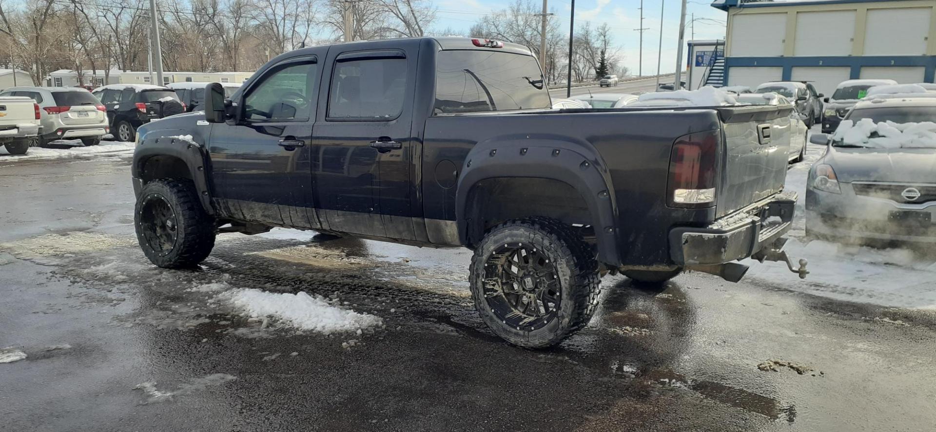 2009 GMC Sierra 1500 SLT Crew Cab 4WD (3GTEK33239G) with an 6.2L V8 OHV 16V engine, 4-Speed Automatic transmission, located at 2015 Cambell Street, Rapid City, SD, 57701, (605) 342-8326, 44.066433, -103.191772 - CARFAX AVAILABLE - Photo#1