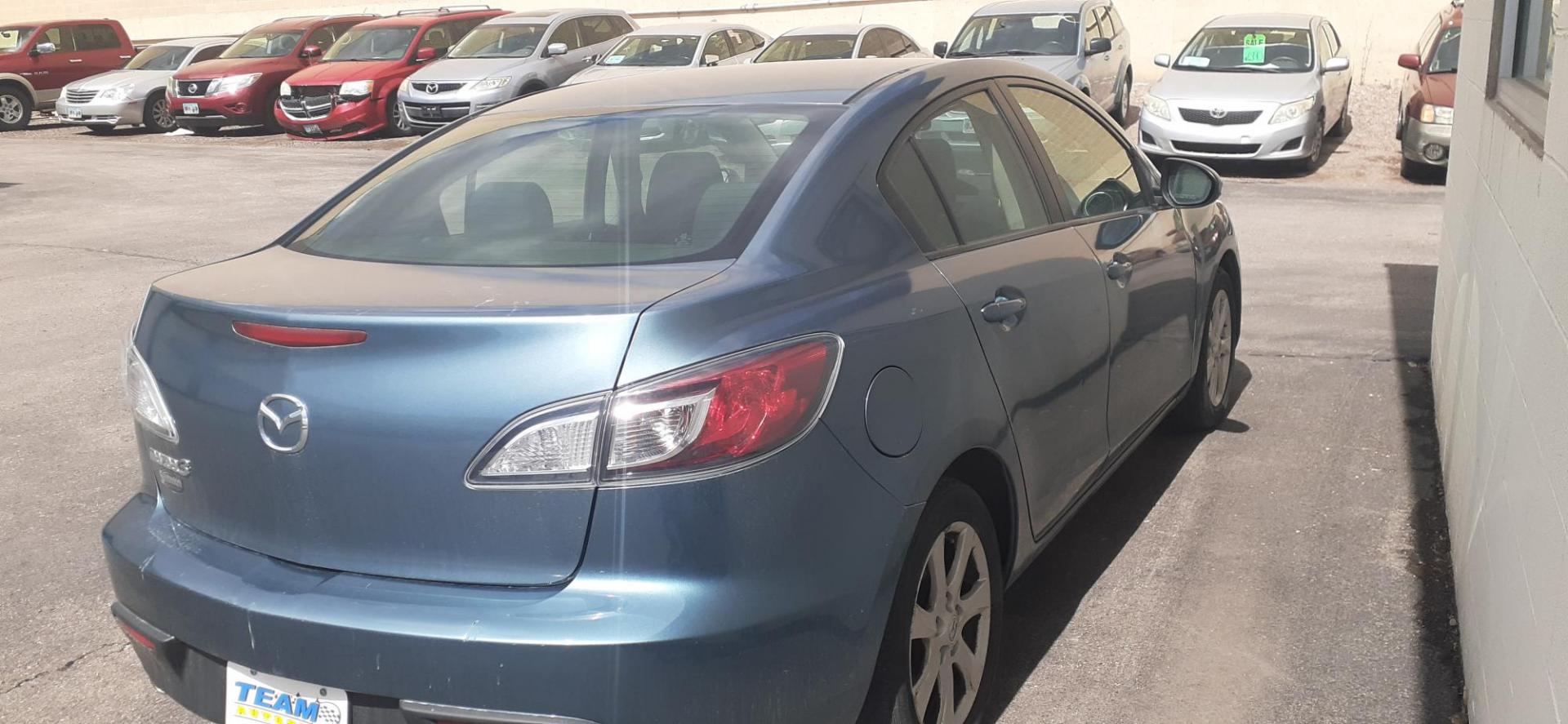 2011 Mazda MAZDA3 i Touring 4-Door (JM1BL1VF9B1) with an 2.0L L4 DOHC 16V engine, located at 2015 Cambell Street, Rapid City, SD, 57701, (605) 342-8326, 44.066433, -103.191772 - CARFAX AVAILABLE - Photo#2