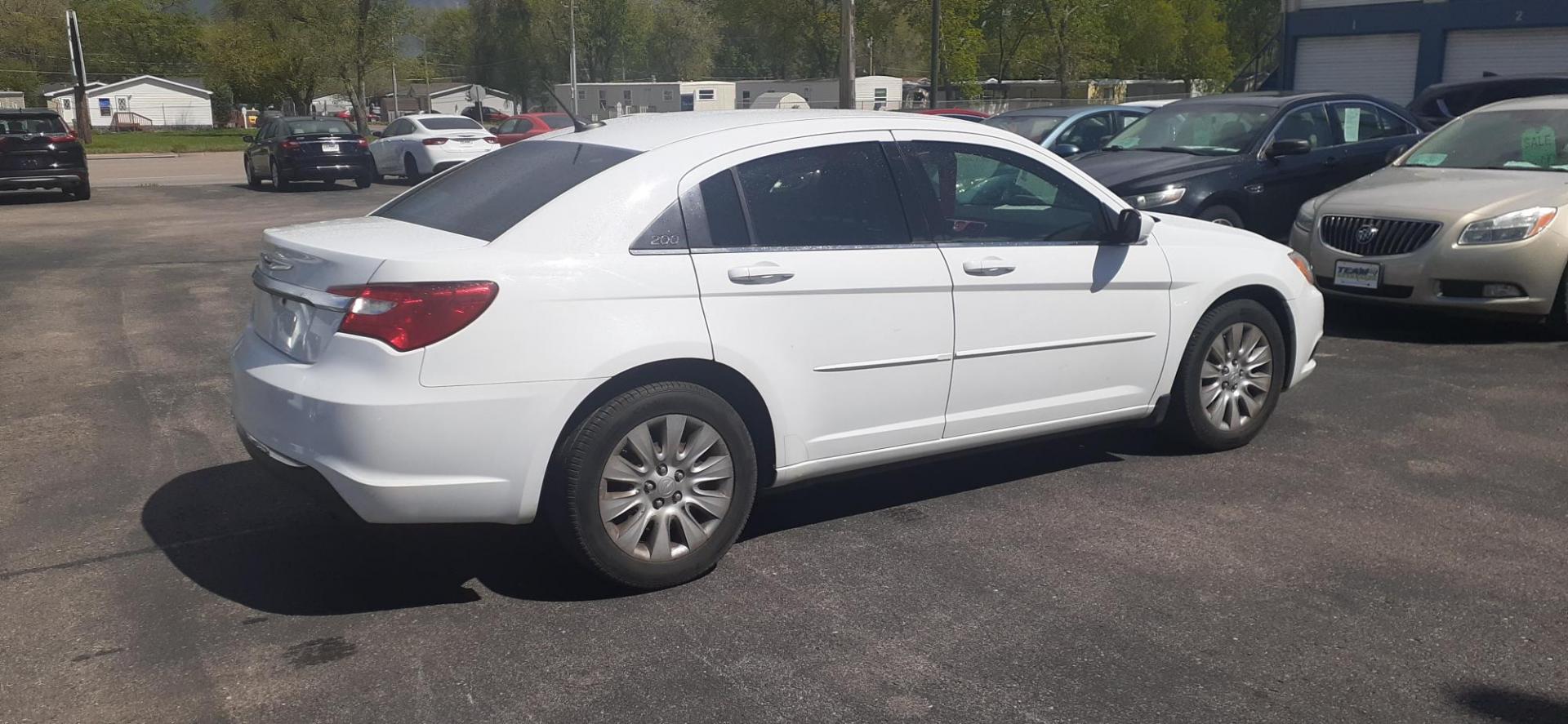 2012 Chrysler 200 LX (1C3CCBAB0CN) with an 2.4L L4 DOHC 16V engine, 6-Speed Automatic transmission, located at 2015 Cambell Street, Rapid City, SD, 57701, (605) 342-8326, 44.066433, -103.191772 - CARFAX AVAILABLE - Photo#6