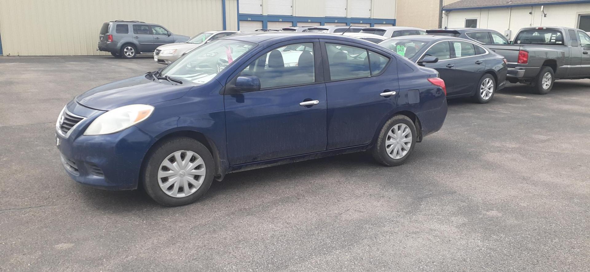 2012 Nissan Versa 1.6 S Sedan (3N1CN7AP4CL) with an 1.6L L4 DOHC 16V engine, 5-Speed Manual transmission, located at 2015 Cambell Street, Rapid City, SD, 57701, (605) 342-8326, 44.066433, -103.191772 - CARFAX AVAILABLE - Photo#1