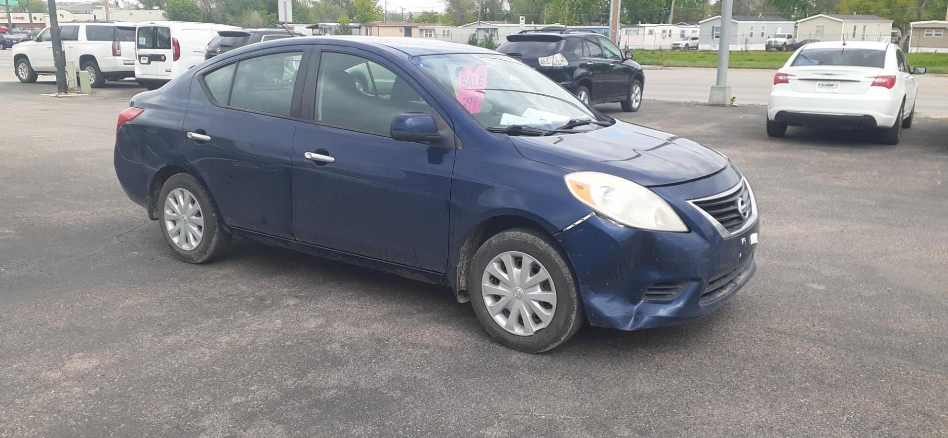 2012 Nissan Versa 1.6 S Sedan (3N1CN7AP4CL) with an 1.6L L4 DOHC 16V engine, 5-Speed Manual transmission, located at 2015 Cambell Street, Rapid City, SD, 57701, (605) 342-8326, 44.066433, -103.191772 - CARFAX AVAILABLE - Photo#4