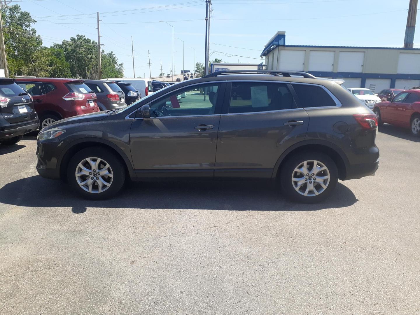 2015 Mazda CX-9 Touring AWD (JM3TB3CA1F0) with an 3.7L V6 DOHC 24V engine, 6-Speed Automatic transmission, located at 2015 Cambell Street, Rapid City, SD, 57701, (605) 342-8326, 44.066433, -103.191772 - CARFAX AVAILABLE - Photo#0