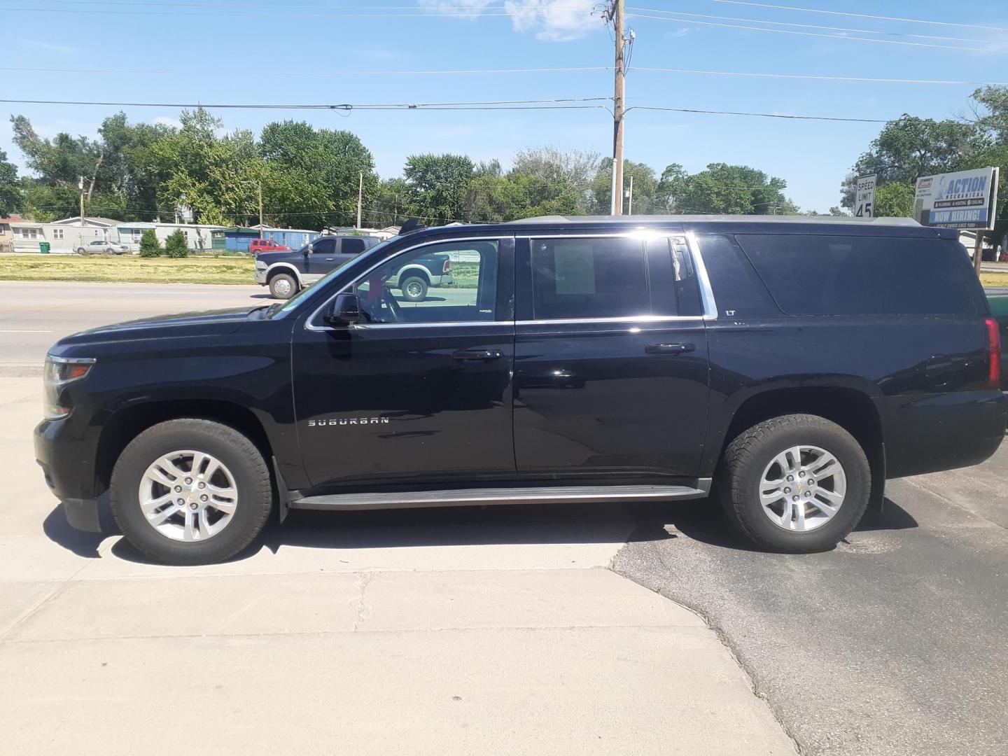 2015 Chevrolet Suburban LT 1500 4WD (1GNSKJKC0FR) with an 5.3L V8 OHV 16V engine, 6-Speed Automatic transmission, located at 2015 Cambell Street, Rapid City, SD, 57701, (605) 342-8326, 44.066433, -103.191772 - CARFAX AVAILABLE - Photo#1