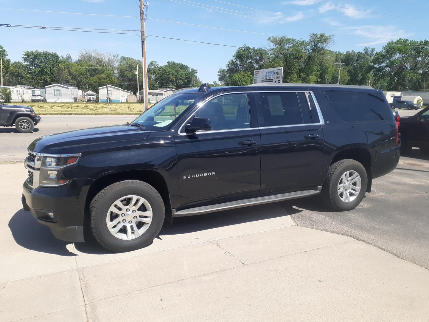 2015 Chevrolet Suburban LT 1500 4WD (1GNSKJKC0FR) with an 5.3L V8 OHV 16V engine, 6-Speed Automatic transmission, located at 2015 Cambell Street, Rapid City, SD, 57701, (605) 342-8326, 44.066433, -103.191772 - CARFAX AVAILABLE - Photo#2