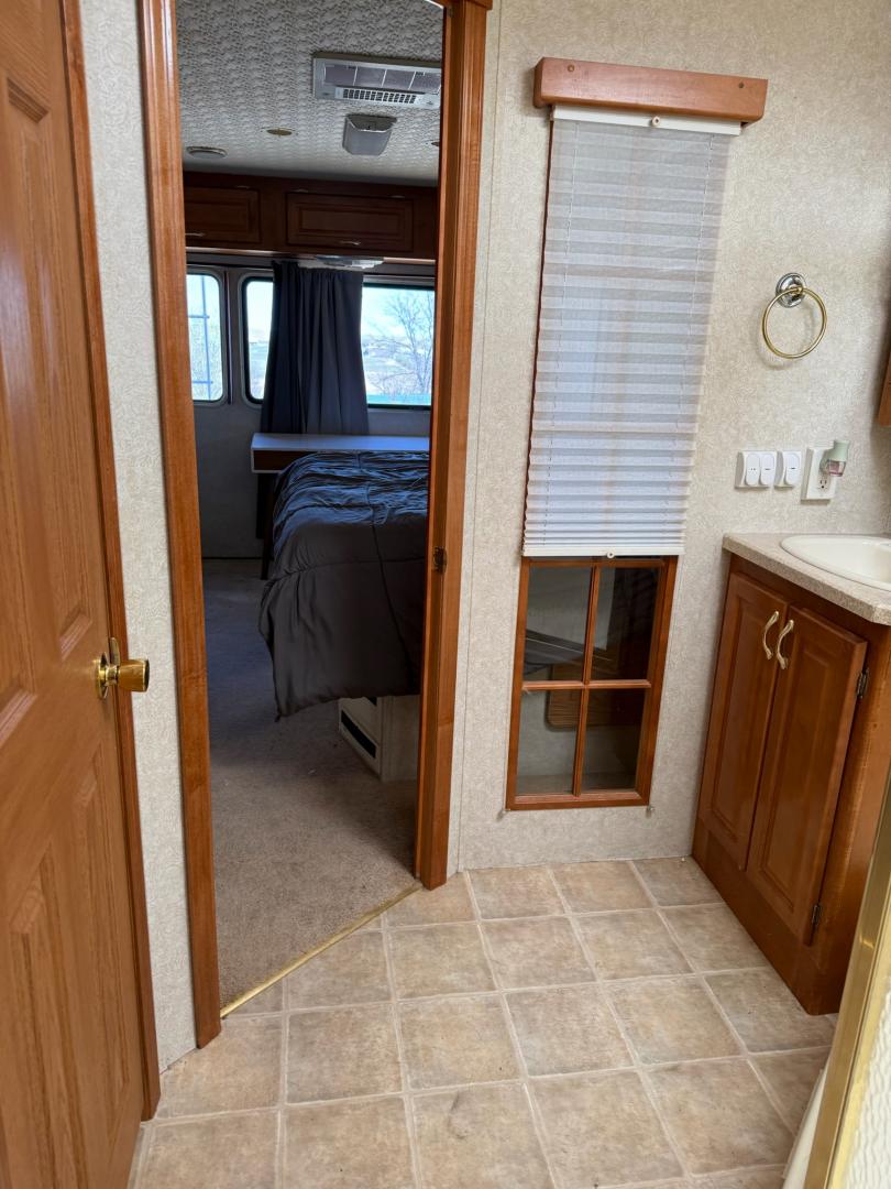 2003 Workhorse W22 Motorhome (5B4MP67G133) with an 8.1L V8 OHV 16V engine, located at 2015 Cambell Street, Rapid City, SD, 57701, (605) 342-8326, 44.066433, -103.191772 - 8.1 GAS MOTOR ALLISON TRANSMISSION ONBOARD GENERATOR 3 SLIDE OUTS QUEEN BED IN BACK WITH NEW MATTRESSES NEW TIRES 2 NEW BATTERIES . - Photo#5