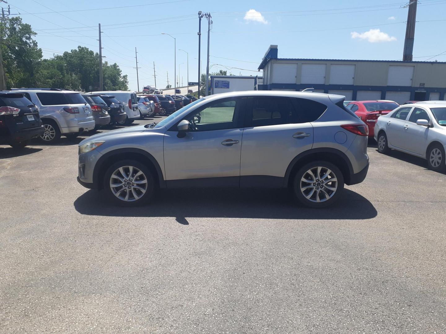 2013 Mazda CX-5 Grand Touring AWD (JM3KE4DEXD0) , 6-Speed Automatic transmission, located at 2015 Cambell Street, Rapid City, SD, 57701, (605) 342-8326, 44.066433, -103.191772 - CARFAX AVAILABLE - Photo#0