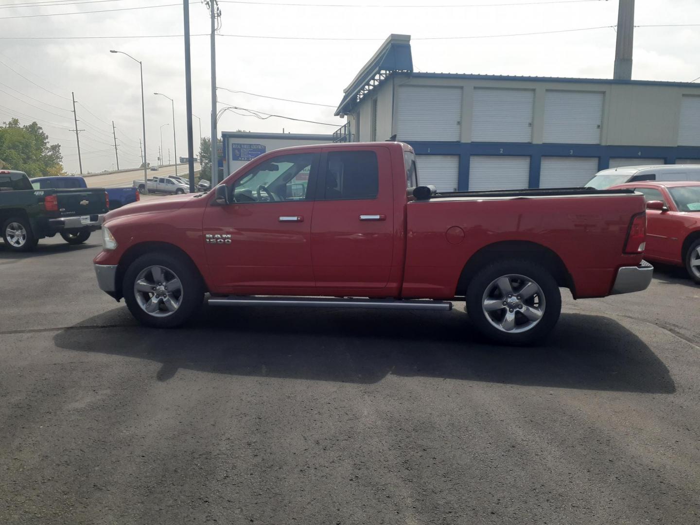 2015 RAM 1500 SLT Quad Cab 4WD (1C6RR7GG7FS) with an 3.6L V6 DOHC 24V FFV engine, 6-Speed Automatic transmission, located at 2015 Cambell Street, Rapid City, SD, 57701, (605) 342-8326, 44.066433, -103.191772 - CARFAX AVAILABLE - Photo#0
