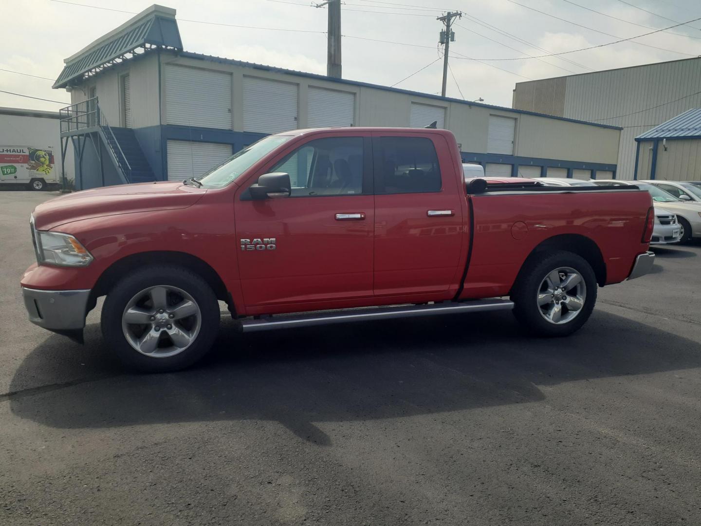 2015 RAM 1500 SLT Quad Cab 4WD (1C6RR7GG7FS) with an 3.6L V6 DOHC 24V FFV engine, 6-Speed Automatic transmission, located at 2015 Cambell Street, Rapid City, SD, 57701, (605) 342-8326, 44.066433, -103.191772 - CARFAX AVAILABLE - Photo#1
